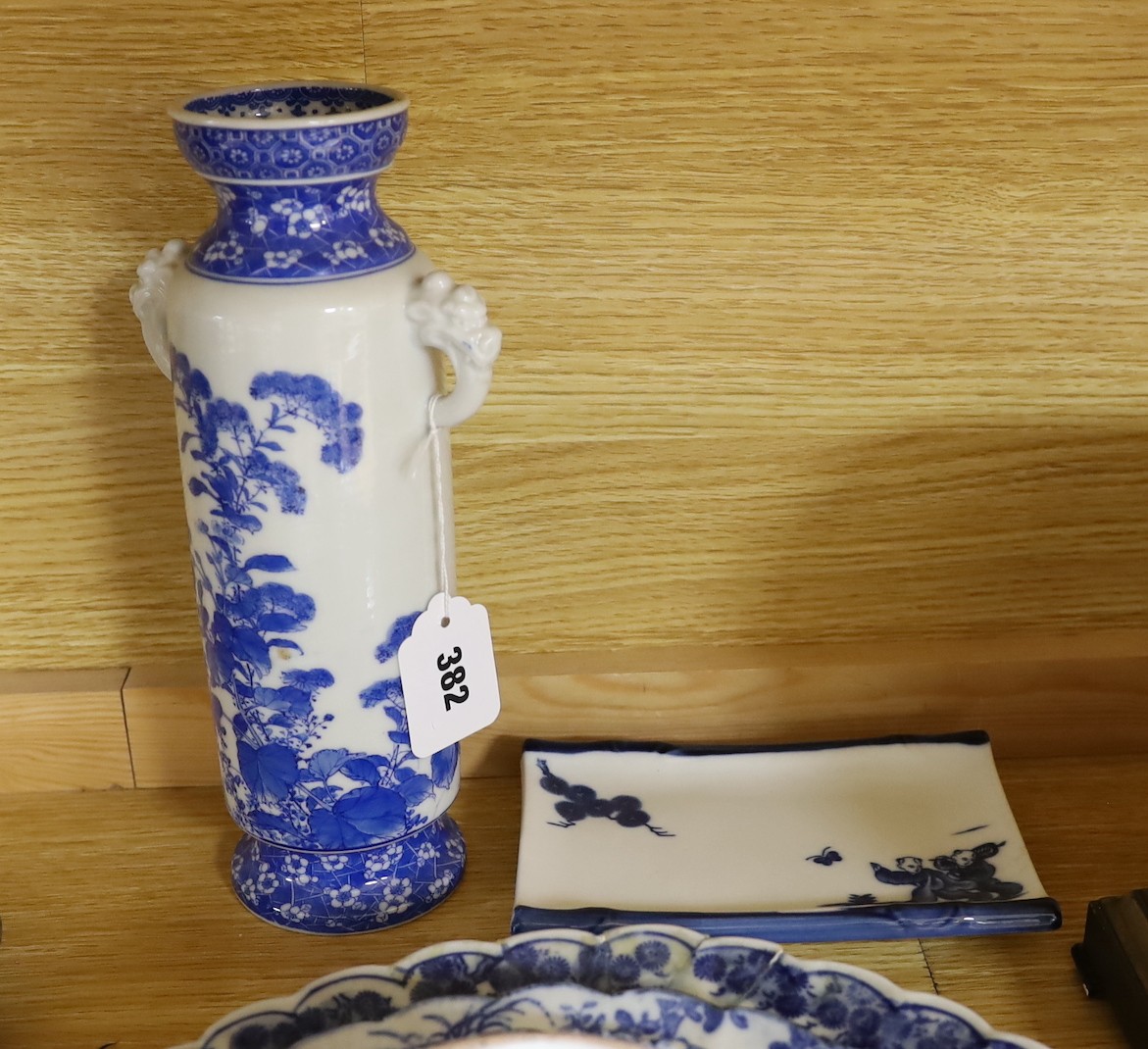 A collection of mostly Japanese blue and white ceramics, late 19th/early 20th century, including a Seto two handle vase, 27 cm high